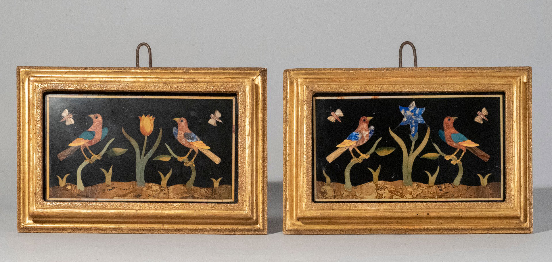 Florence, 18th century, Pair of commesso marble plaques depicting birds and butterflies on shrubs (with murrina eyes)